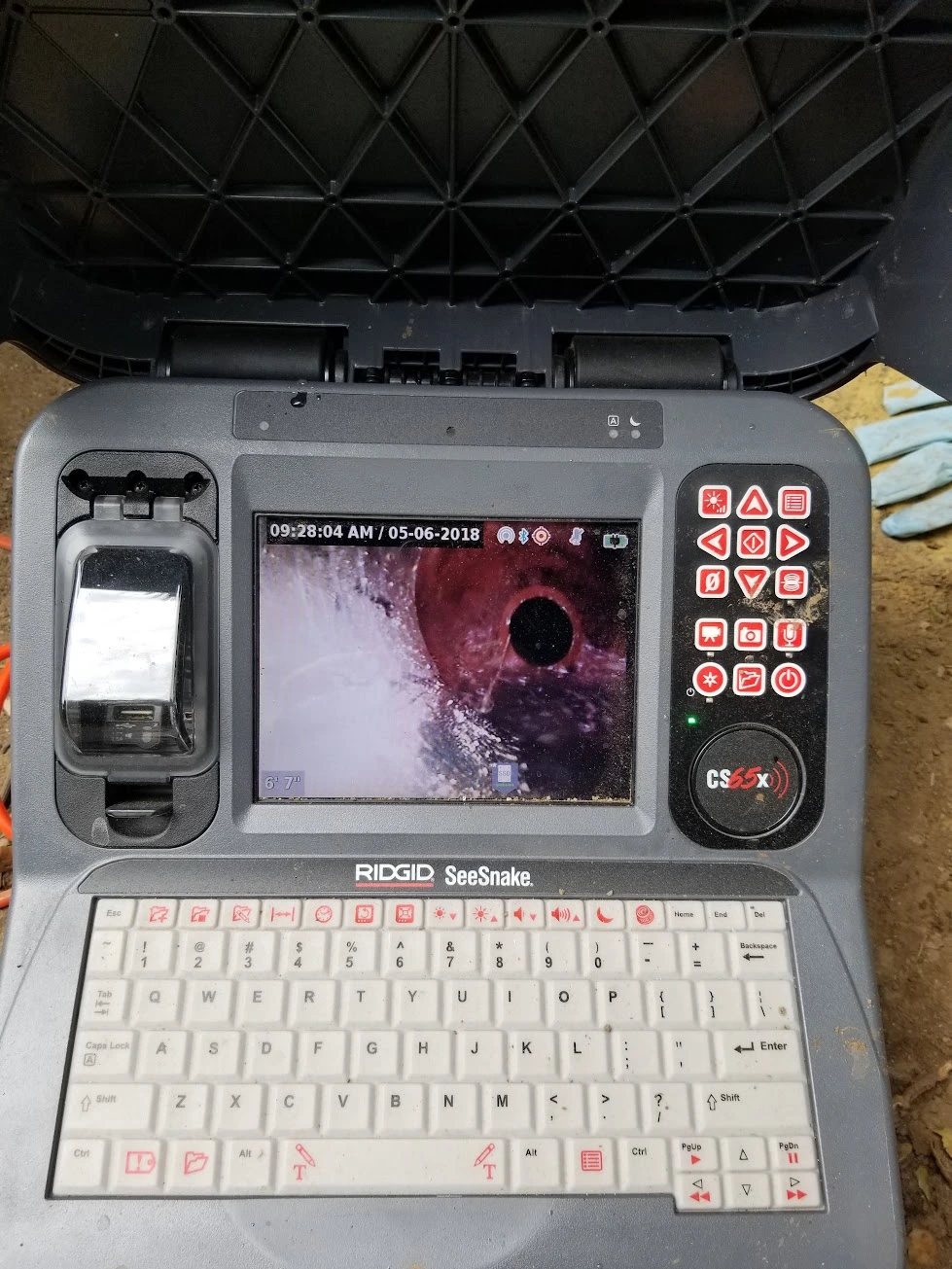 Sewer camera inspection in progress with monitor view
